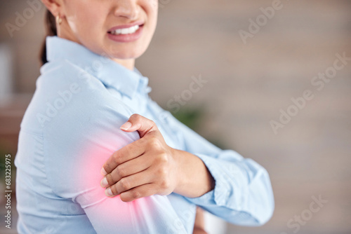Business woman, shoulder pain and injury from accident, inflammation or sore joint at office. Closeup of female person and ache, strain or broken arm in cramp, muscle tension or red area at workplace photo