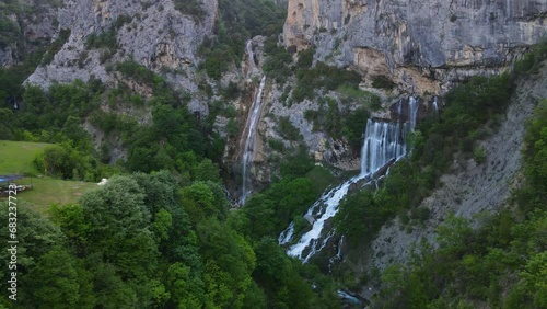 Aerial view of Ujevara E Sotires waterfalls near Progonat village in Nivica Canyon, a stunning natural landscape. photo