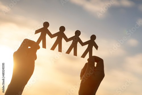 Teamwork and relations concept. symbolic of paper chains. People are connected to each other. Concept of human role. The concept of teamwork, family home, teamwork, society, social network