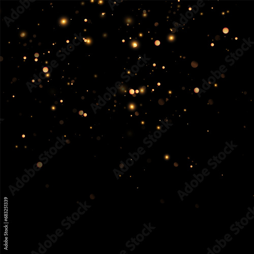 Golden sequins glow with many lights. Glittering dust. Luxurious background of golden particles. © blagorodez