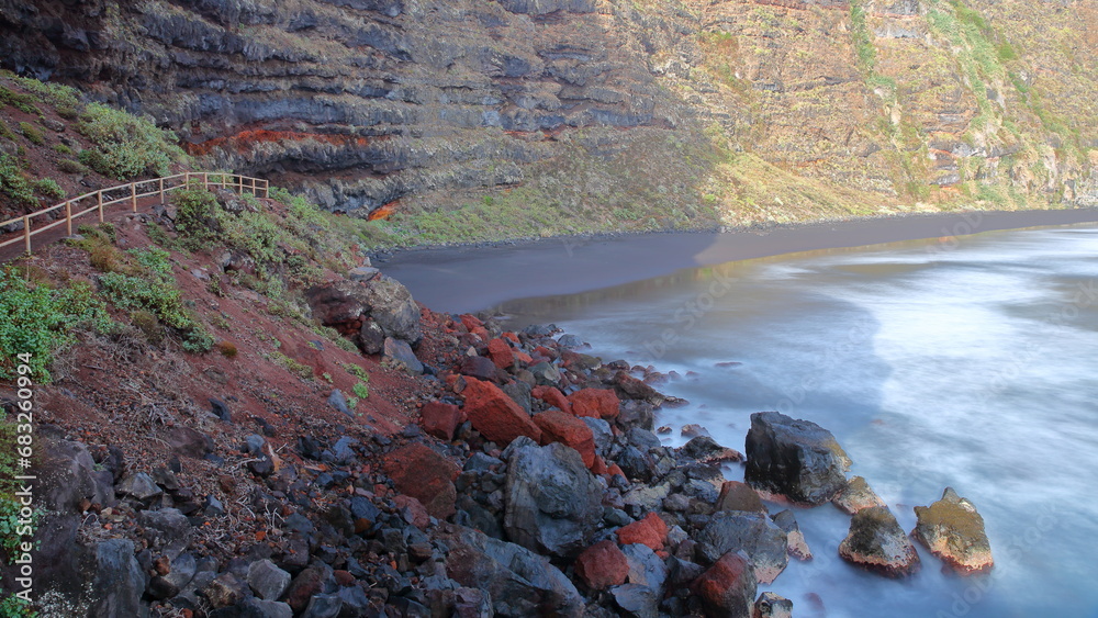 Playa de Nogales (Nogales beach), located near Puntallana, La Palma, Canary Islands, Spain, viewed from a hiking path surrounded by a volcanic and rocky landscape