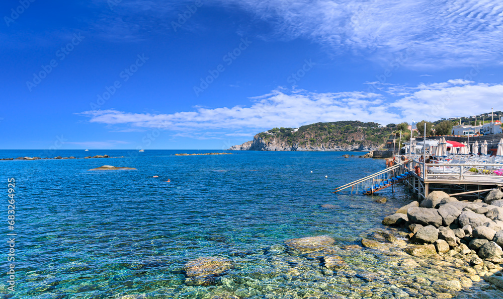 View of Ischia Island coast : rocky beach of Forio town in southern Italy.