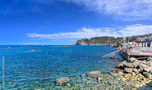 View of Ischia Island coast : rocky beach of Forio town in southern Italy.