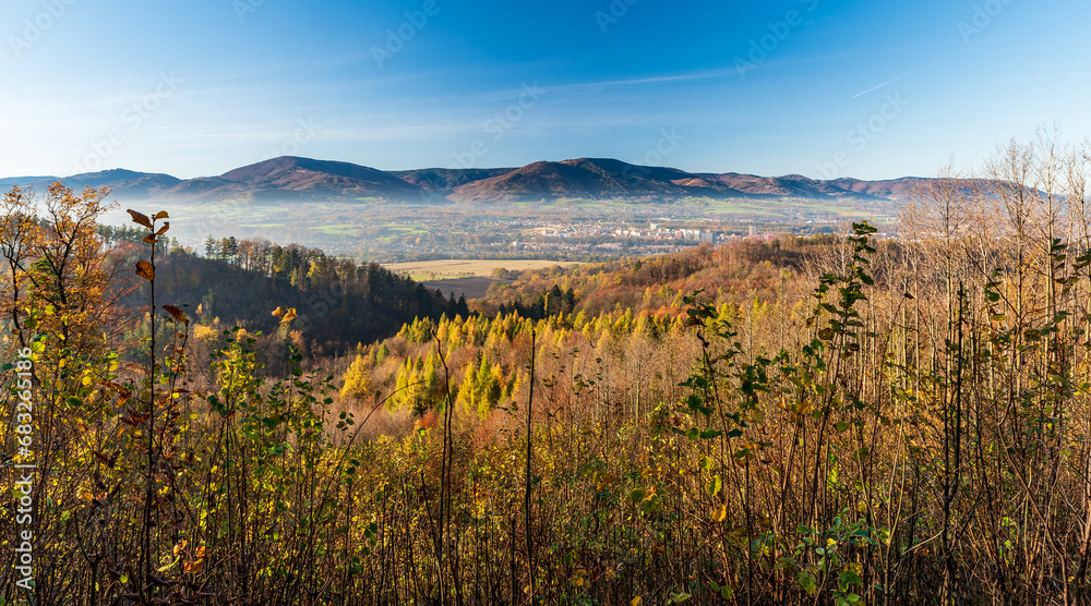 Trinec city with Moravskoslezske Beskydy mountains on the background in Czech republic during autumn morning - obrazy, fototapety, plakaty 