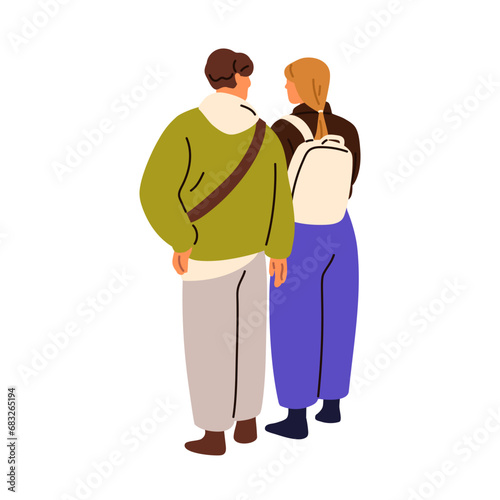 Young couple, man and woman standing together, talking, view from behind, bac...