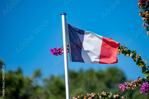 French flag on beach houses in Arcachon Bay Cap Ferret peninsula, France, southwest of Bordeaux along France's Atlantic coastline photo