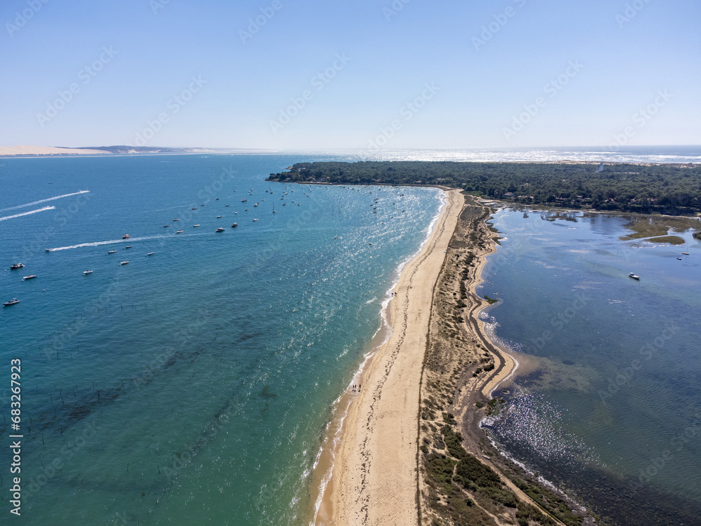 Aerial view on Arcachon Bay with many fisherman's boats and oysters farms near Le Phare du Cap Ferret, Cap Ferret peninsula, France, southwest of Bordeaux, France's Atlantic coastline