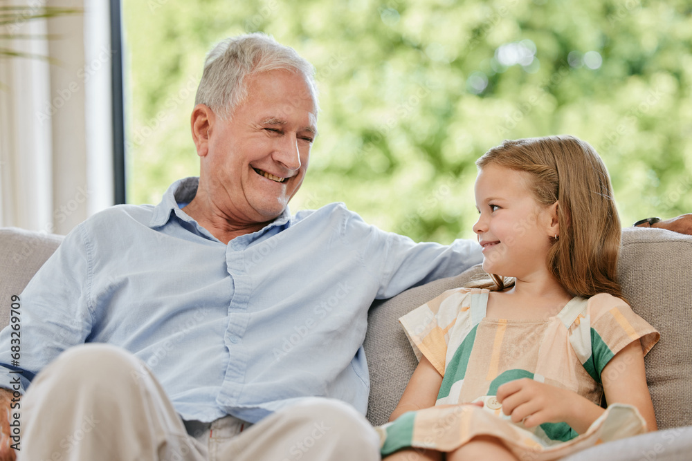 Conversation, smile and grandfather with child on a sofa bonding, relaxing and talking at home. Happy, family and senior man speaking to young girl kid on a couch in the living room at modern house. Conversation, smile and grandfather with child on a sofa bonding, relaxing and talking at home. Happy, family and senior man speaking to young girl kid on a couch in the living room at modern house.