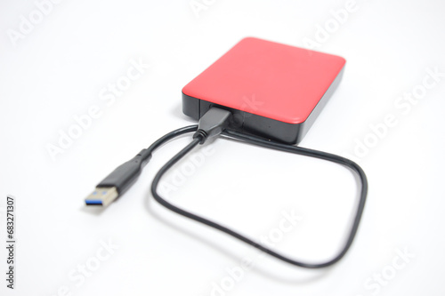 External hard disk drive with USB cable isolated on white background. Memory drive.