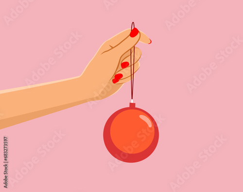 Female hand holding a baubl...
