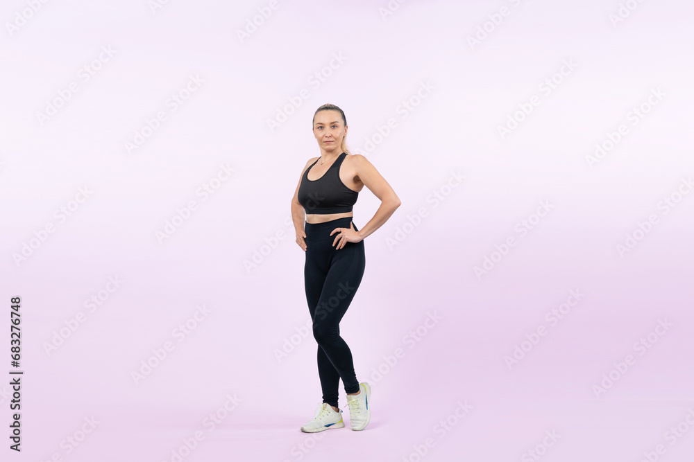 Active and fit physique senior woman portrait with happy smile on isolated background. Healthy lifelong senior people with fitness healthy and sporty body care lifestyle concept. Clout