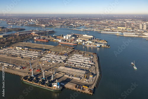 Aerial view Dutch industrial park with harbors and ships