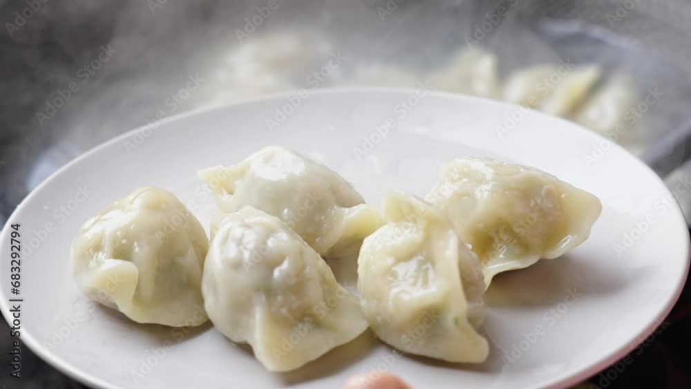 Close up fresh boiled dumplings Put on a plate Close up fresh boiled dumplings Put on a plate
