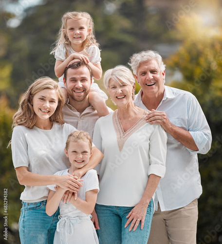 Portrait of big family in backyard together with smile, grandparents and parents with kids in park. Nature, happiness and men, women and children in garden with love, support and outdoor bonding. photo