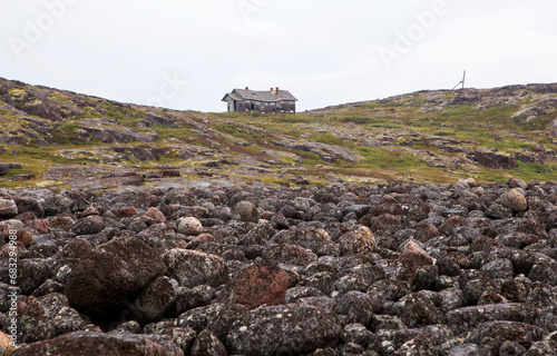 A cluster of stone boulders on the shores of the Barents Sea. Rural settlement Teriberka. Kola district, Murmansk region. Russia photo