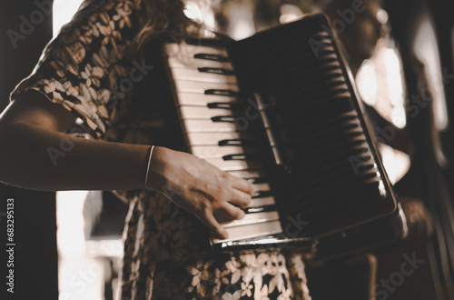 woman playing the accordion, vintage style photo