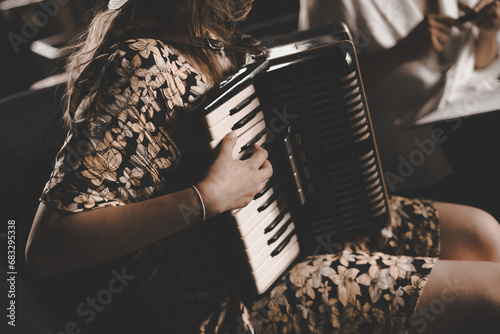 woman playing the accordion, vintage style photo