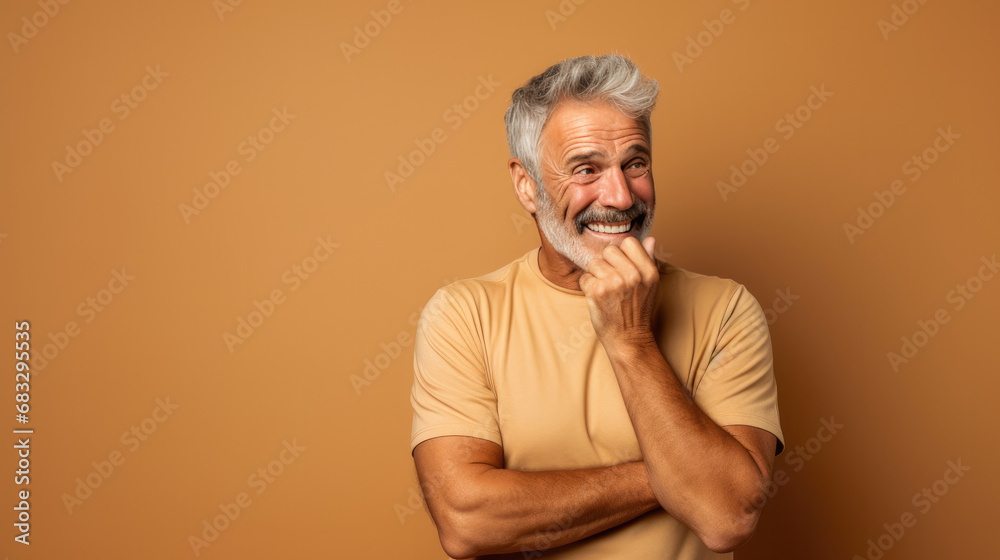 Embarrassed 58 years old male athlete, blushing, wearing a Bright solid beige dress. Embarrassed 58 years old male athlete, blushing, wearing a Bright solid beige dress.