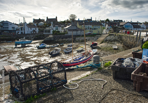 Cemaes Harbour Anglesey North Wales with boats and lobster pot