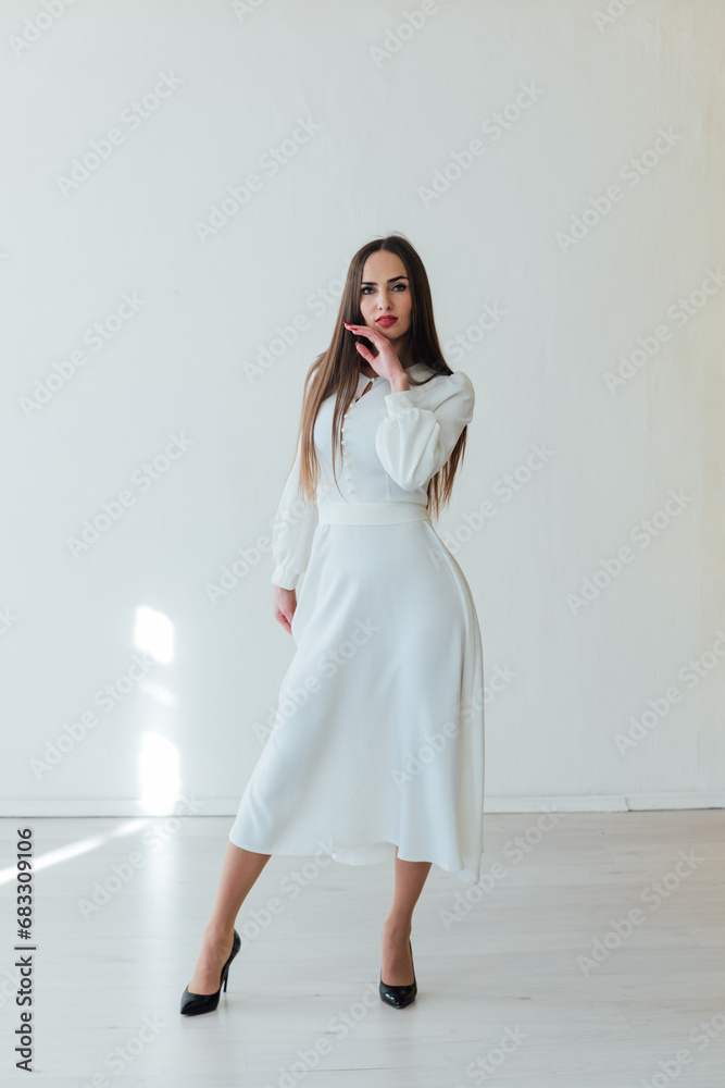 Brunette woman posing on white background Brunette woman posing on white background