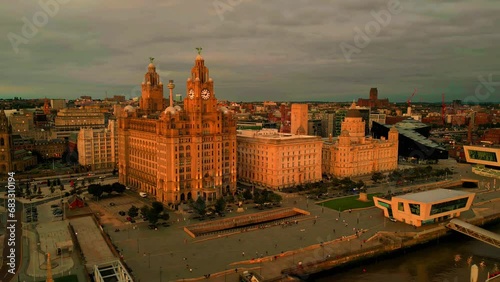 Liverpool, Merseyside, UK, August 9, 2023; Aerial orbit clip of the Royal Liver Building, Cunard Building and Port of Liverpool Building, Pier Head Waterfront, Liverpool, Merseyside. photo