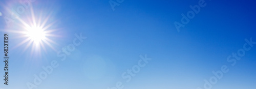Blue with gradient sky with a sunny halo, copy space