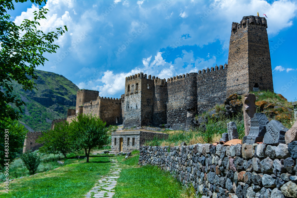 Khertvisi Fortress, Georgia, a medieval castle with watchtowers and citadel on a green rocky mountain in the mountains of the Lesser Caucasus in Samtskhe - Javakheti (Meskheti).