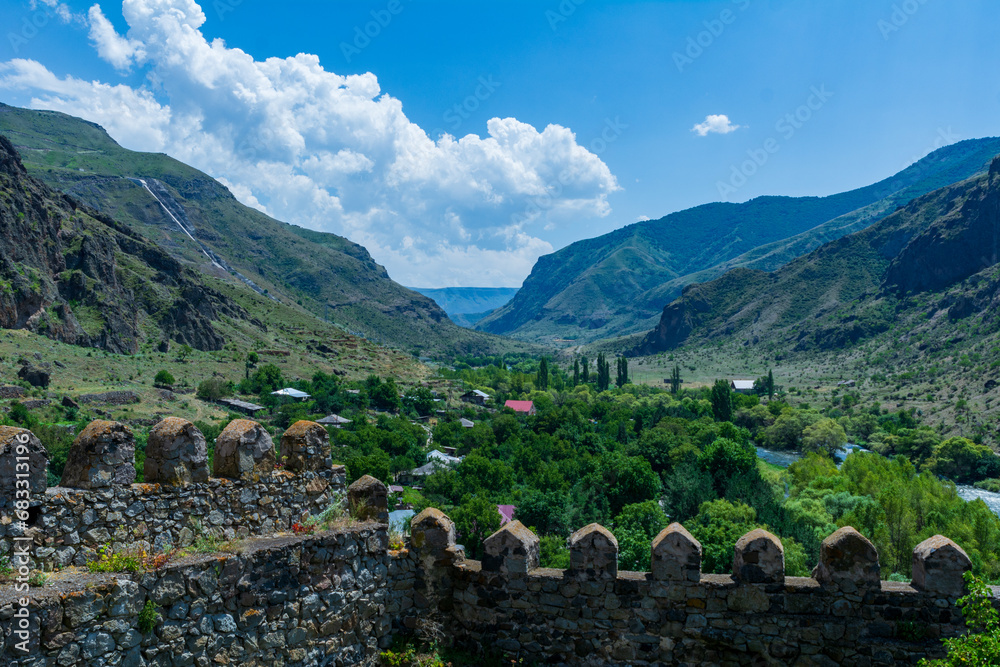 Khertvisi Fortress, Georgia, a medieval castle with watchtowers and citadel on a green rocky mountain in the mountains of the Lesser Caucasus in Samtskhe - Javakheti (Meskheti).