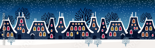 Cute Christmas and winter Night city houses. Snowy Windows of the lights town panorama.