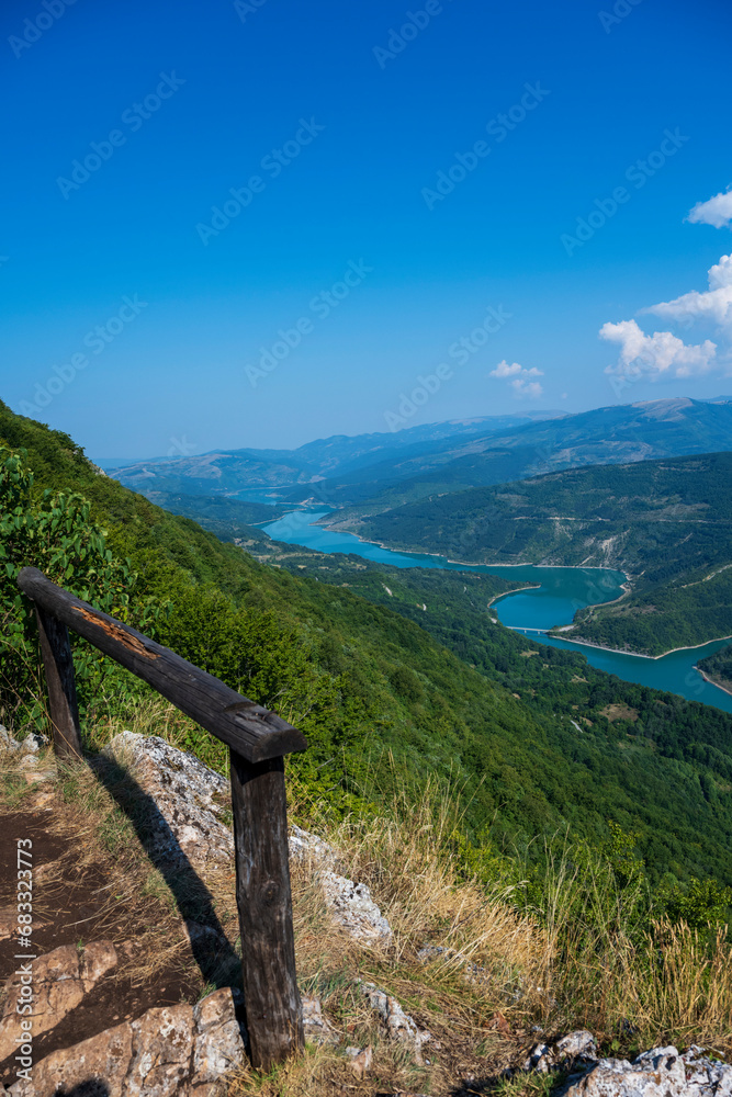 The Kozji Kamen viewpoint offers a beautiful view of Lake Zavojsko, the meanders of the Visocica River and mountain peaks. Serbia near Pirot.