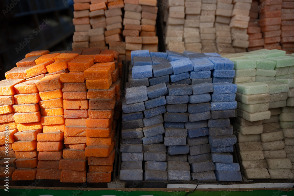 Stunning view of a pile of solid perfumes in Marrakesh's souk, Morocco. Colorful handmade solid perfume tablets.