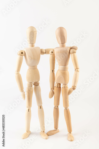 Wooden people hugging. People relationship concept. Friends.