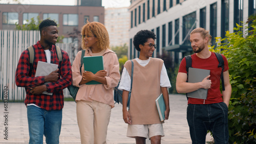 Wallpaper Mural Diverse multiracial students boys girls talk walk in city education multiethnic friends happy talking conversation communicate walking college classmates group smiling together university friendship Torontodigital.ca