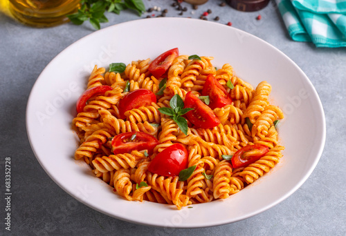Fusilli pasta, spiral or spirali pasta with tomato sauce - Italian food style
