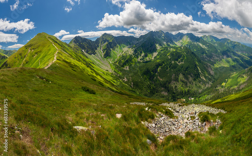 Sunny summer day and magical landscape in Tatra Mountain. Tatra National Park, Poland. View grom top of Rakon sumit. Border Poland - Slovakia. Active lifestyle, trekking and discover the world. photo