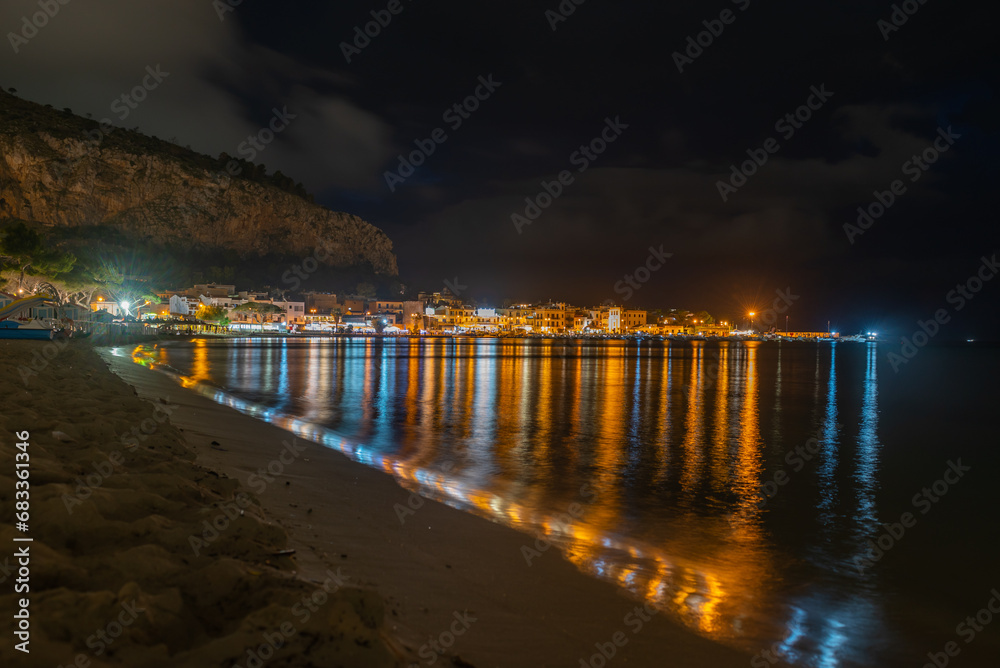 Landscape of Mondello Beach Near The City Of Palermo, In The South Of Italy Illuminated At Night In Summer Landscape of Mondello Beach Near The City Of Palermo, In The South Of Italy Illuminated At Night In Summer