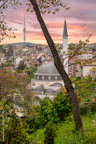 Haci Mehmet Ali Ozturk Mosque after sunrise with Kucuk Camlica TV Radio Tower in the far end, located in Kuzguncuk neighbourhood, Uskudar district, in the Asian side of Istanbul, Turkey photo