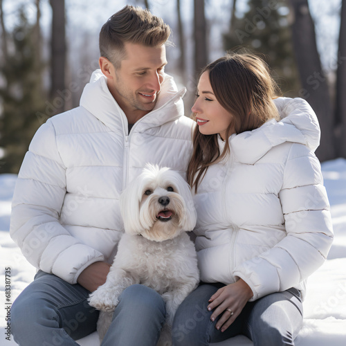 romantic couple and pet dog enjoy landscape view in the winter