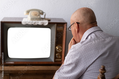 senior, man watching television, old tube vintage 60s TV, mockup on empty white screen, Online streaming and television, Home entertainment, Media and advertising, retro technology