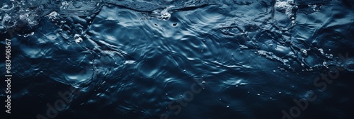 banner dark blue water surface with ripples top view photo