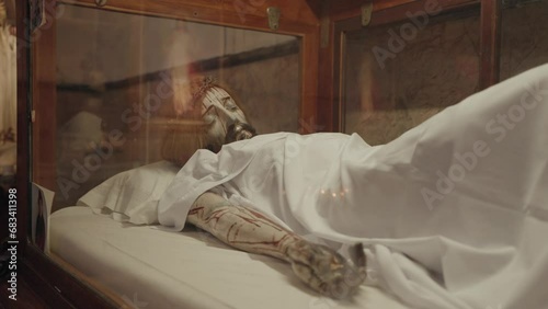 Statue of Jesus Christ Sleeping with a lot of bruises photo