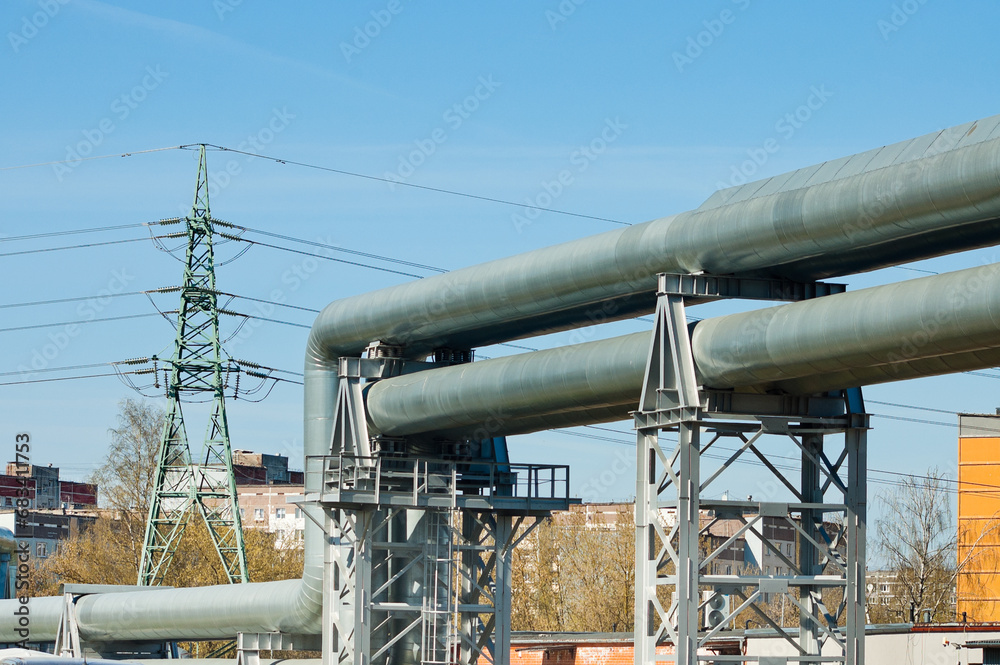 pipeline and power lines against the blue sky pipeline and power lines against the blue sky