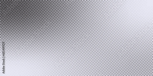 Halftone faded gradient texture. Grunge halftone grit background. White and black sand noise wallpaper. photo