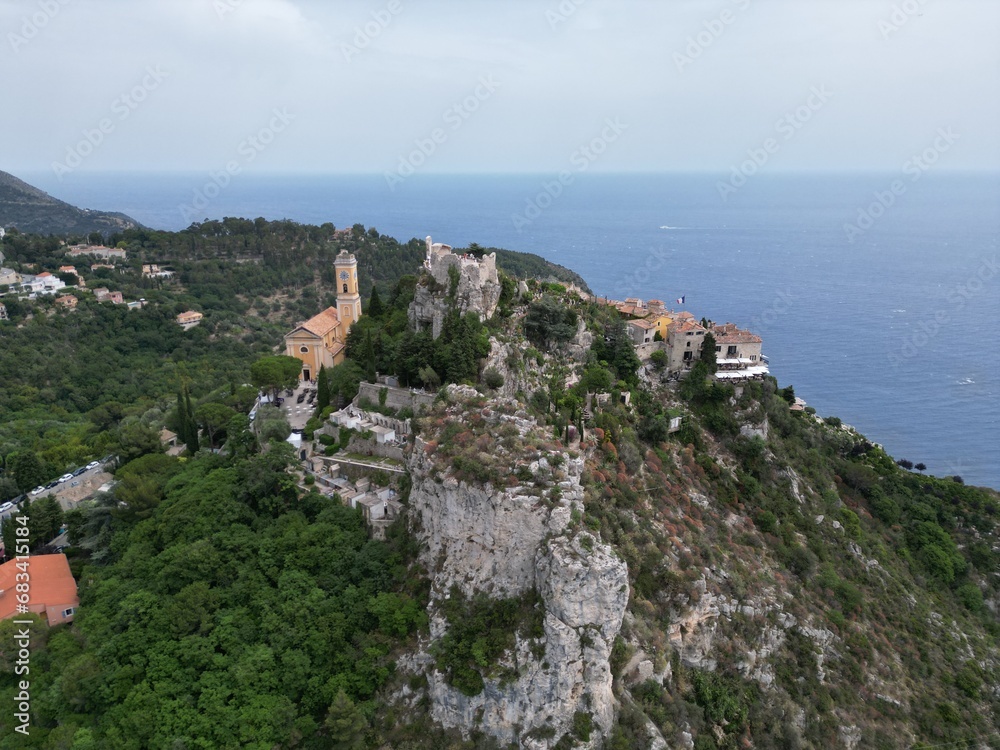 Eze hill top village perched on rocks France Drone , aerial , view from air .