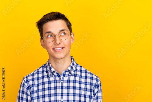 Portrait of minded clever nerd geek man look empty space decide genius thought isolated vivid color background
