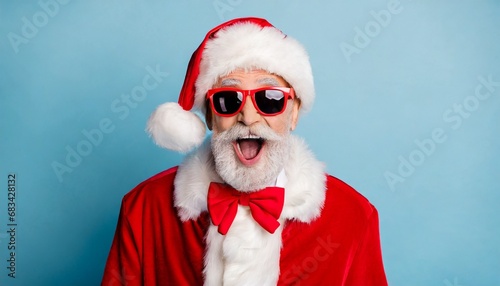 Close-up photo of retired old Santa Claus. white beard, mouth open, looking confused. He is dressed in a Santa costume and wearing a hat. on isolated background. 
