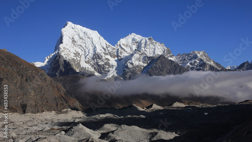 Ngozumba Glacier and high mountains Cholatse and Tobuche, Nepal. photo