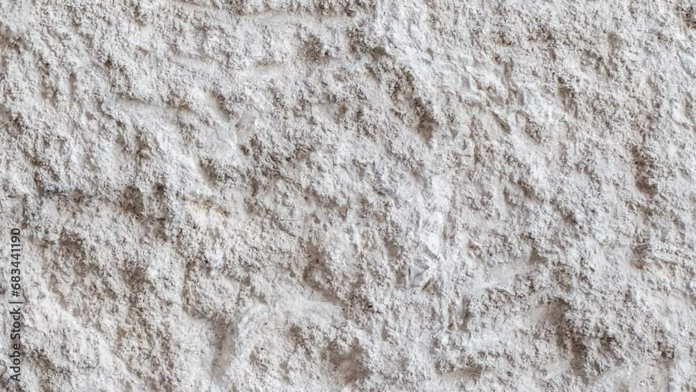 Background, shell stone with chopped traces of pickaxe, uniform texture background, moving sideways, close-up macro Background, shell stone with chopped traces of pickaxe, uniform texture background, moving sideways, close-up macro