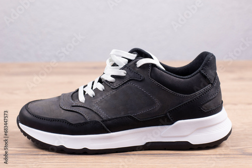 Sneakers Sports shoes with white soles. On a wooden background. Footwear