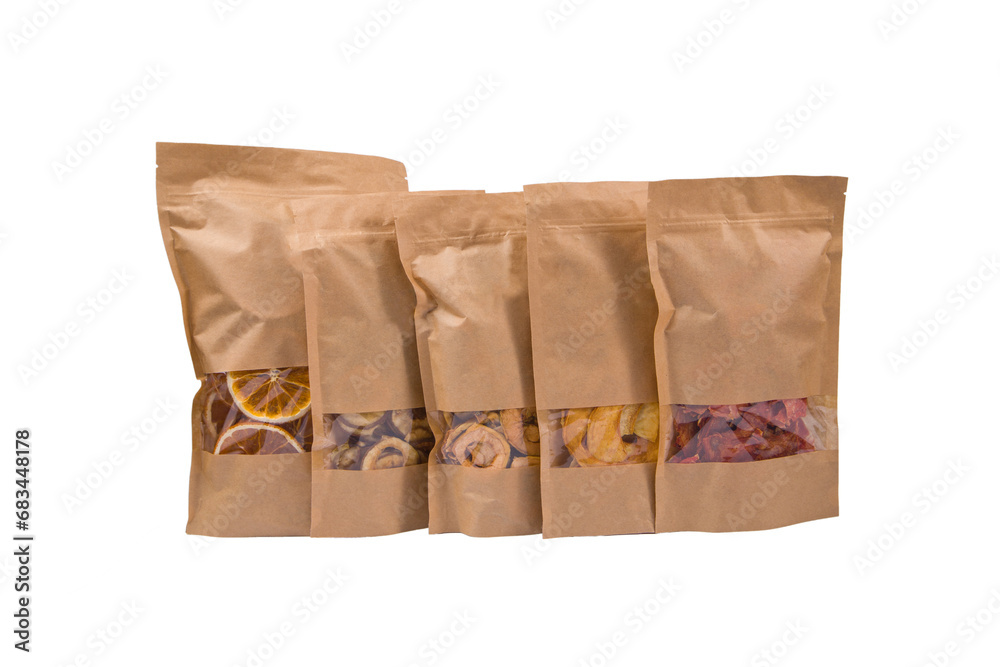 set of paper bags with dried fruit white background